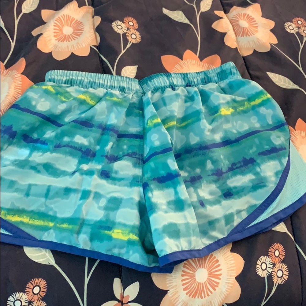 Blue and green under armor running shorts